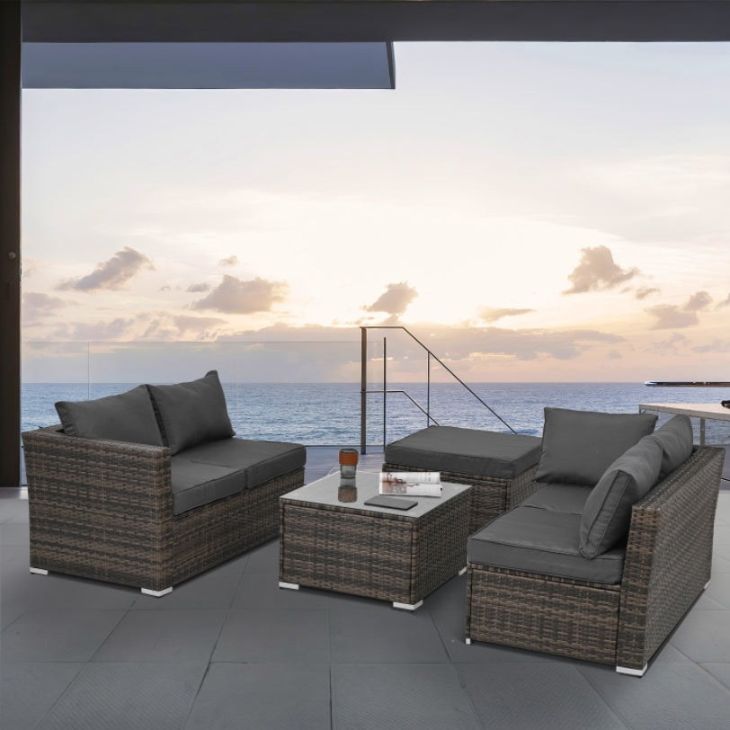 Patio Furniture 4-Piece Set – Seasonal PE Wicker Outdoor Sofa with Tempered Glass Coffee Table & Ottoman (Brown)