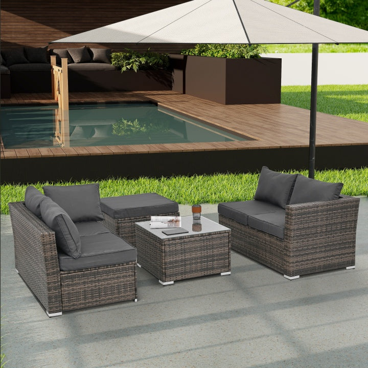 Patio Furniture 4-Piece Set – Seasonal PE Wicker Outdoor Sofa with Tempered Glass Coffee Table & Ottoman (Brown)